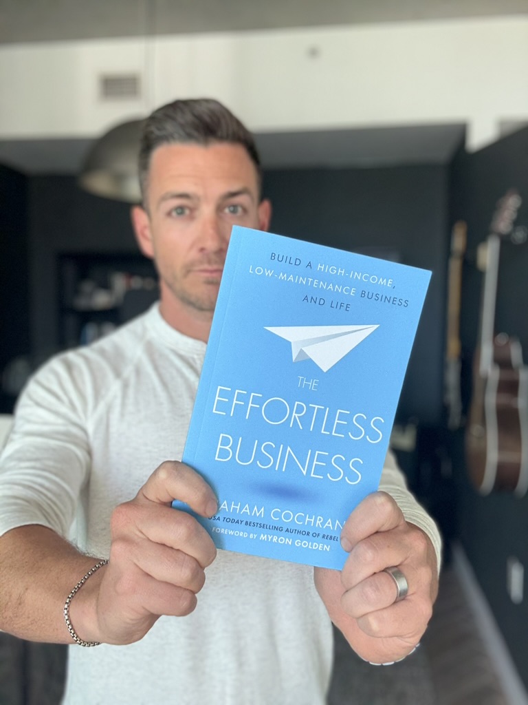 Graham Cochrane holding The Effortless Business book